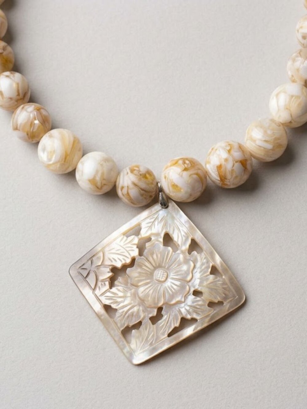 Necklace - Carved shell pendant and white and tan beaded Necklace